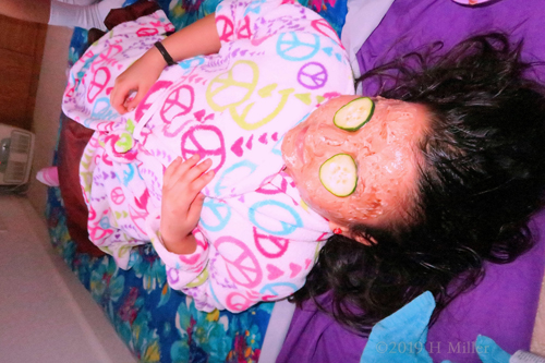 Smiling With Her Kids Facial Masque And Cukes On! Smiling With Her Kids Facial Masque And Cukes On!